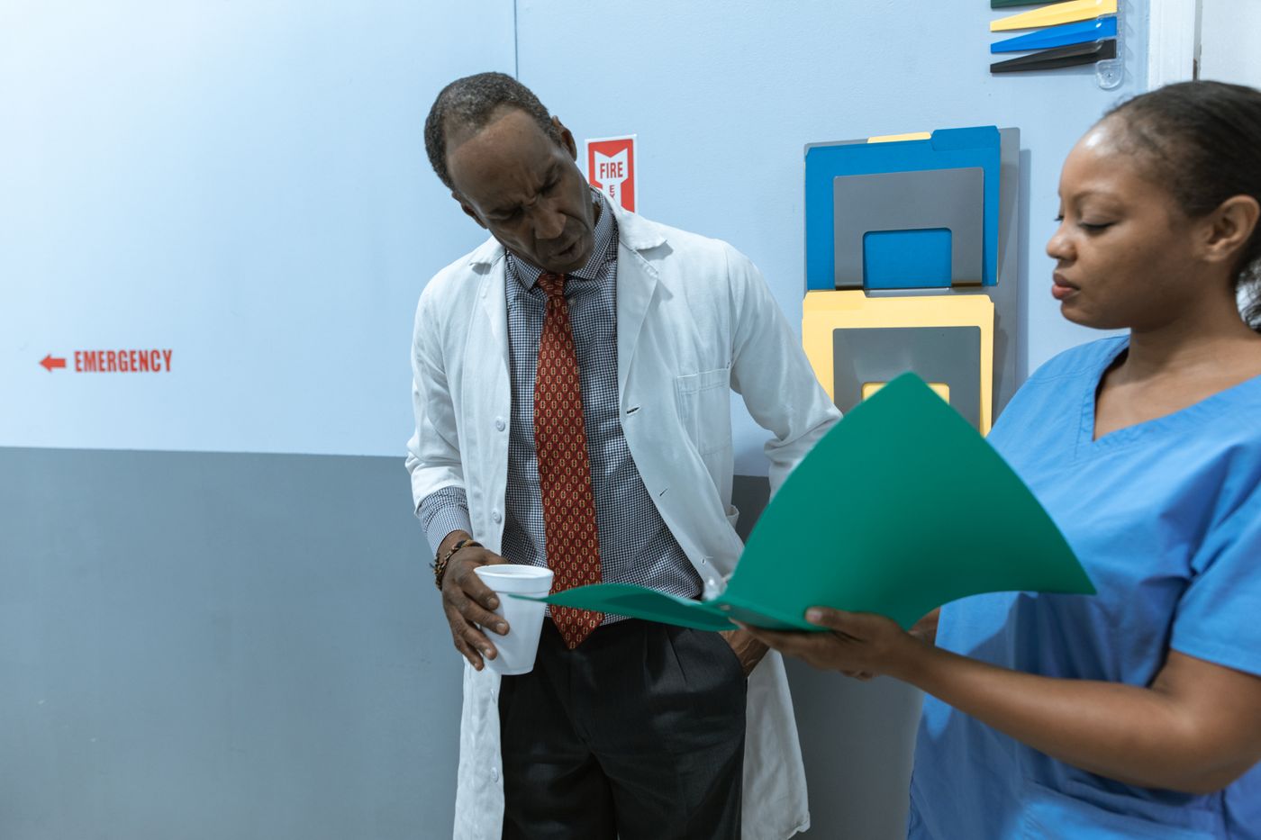 Doctor and nurse reviewing a patient file