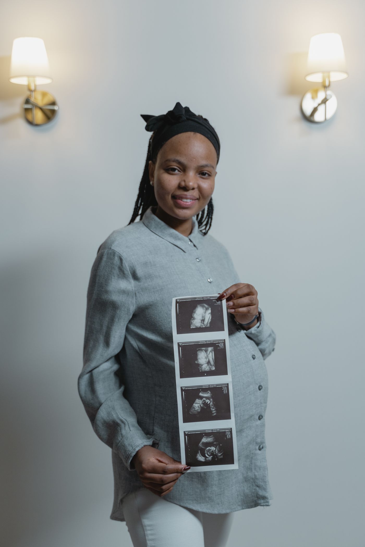 Expectant mother holding her ultrasound scans