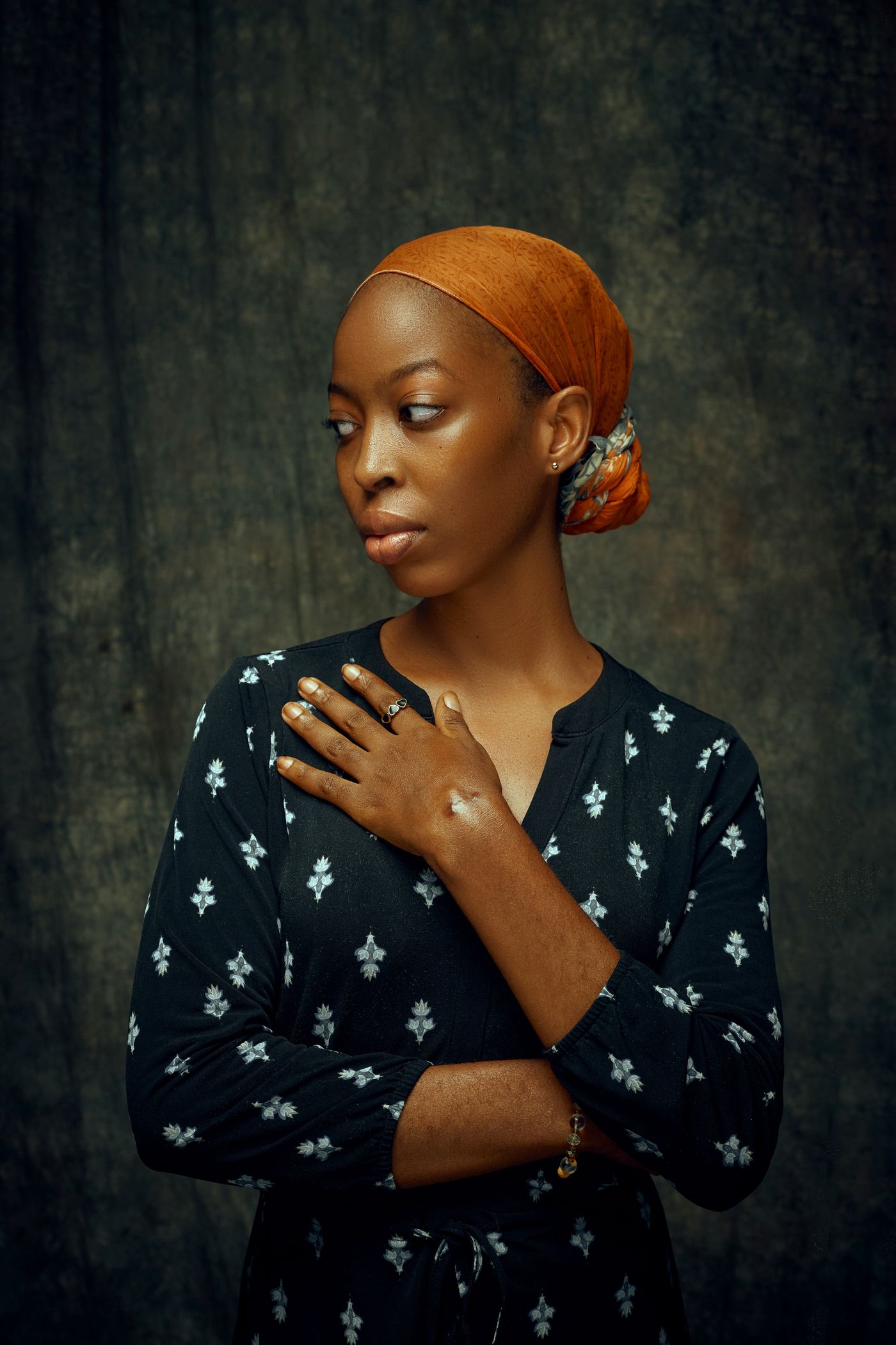 Woman with her hand on her chest