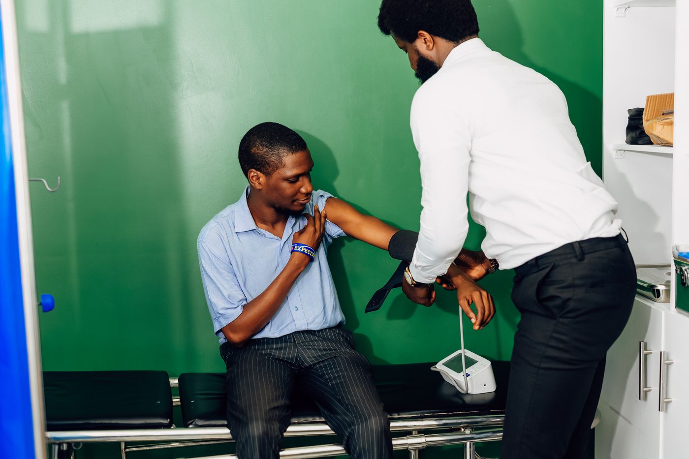 Doctor checking a patient's blood pressure